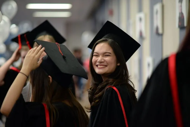 Cognita graduate           
  celebrating academic achievement